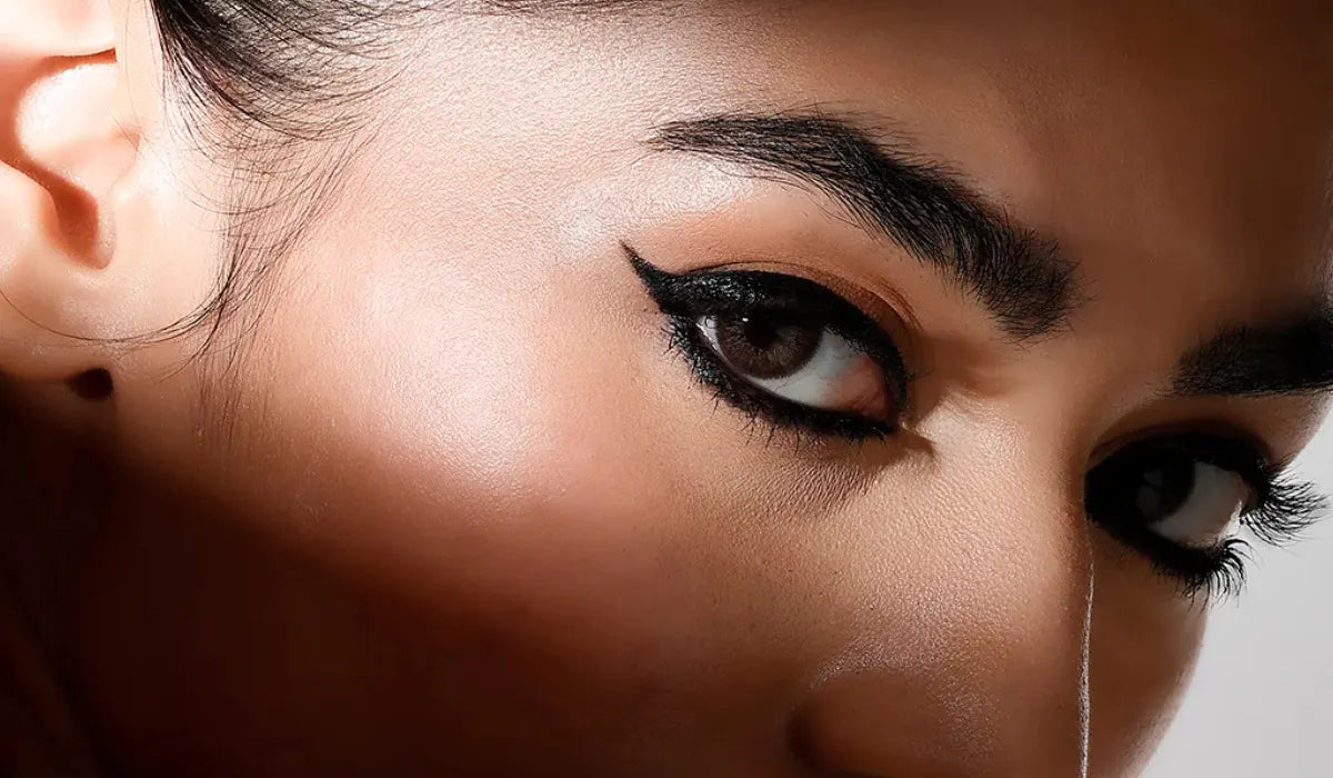 Woman applying smudge proof waterproof kajal for daily use in India