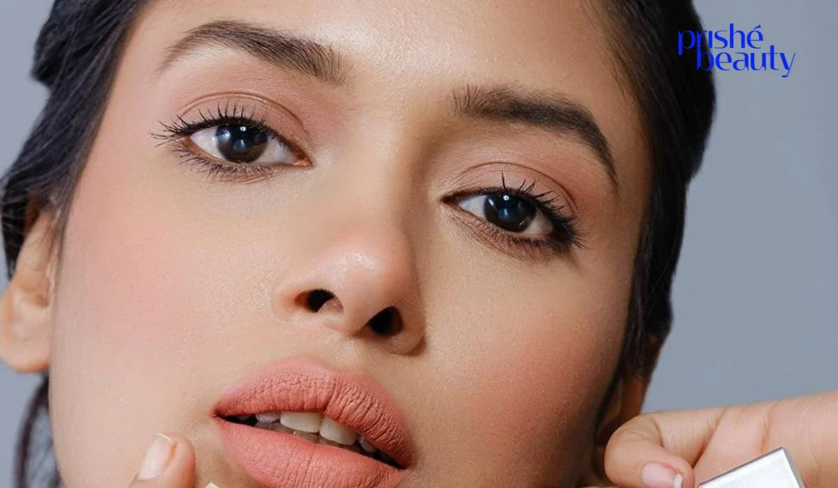 Beginner blending brown eyeshadow with a fluffy makeup brush for a smooth, natural eye makeup look.