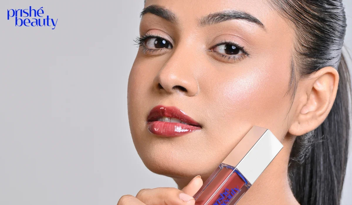 Woman applying long-lasting lip gloss with smooth and glossy lips after proper lip preparation.